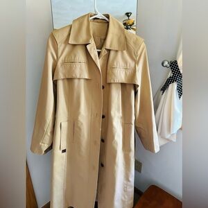Light brown trench coat worn twice in good condition. Made in Hongkong.